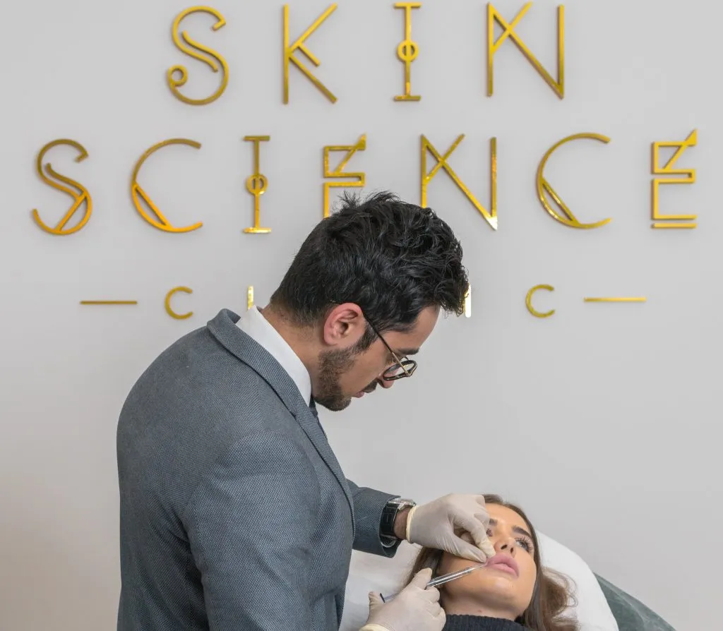 Dr Adil with a Dermal Injection Procedure