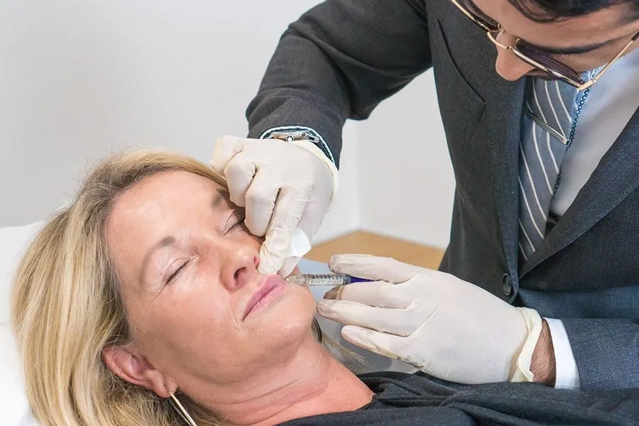 Nasolabial and marionette line filler being administered