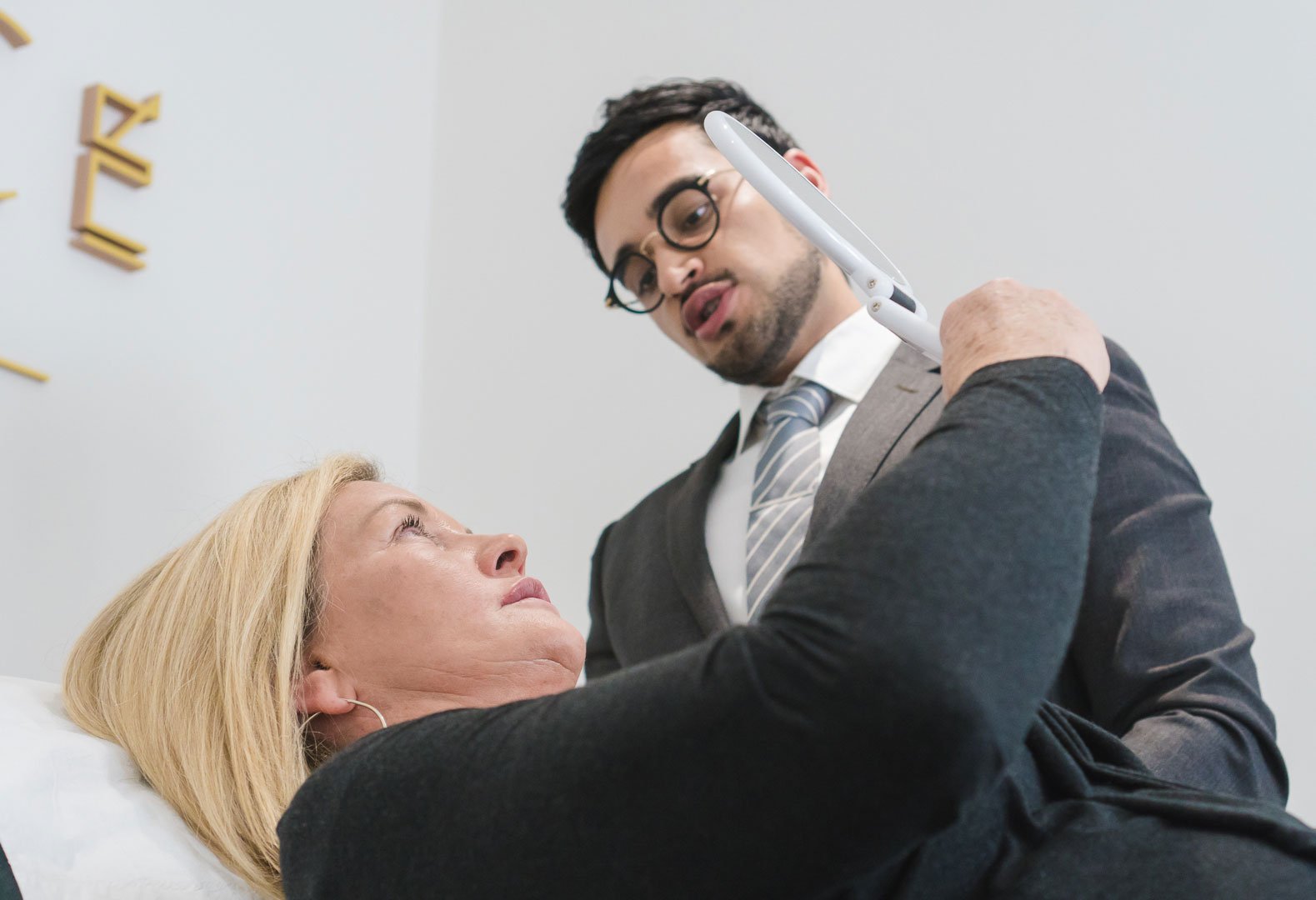 Dr Adil Sarwar performing cheek filler treatment at Skin Science Clinic, London