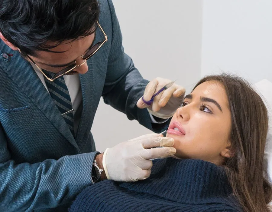 Dr Adil with a chin Botox patient at Skin Science Clinic in London