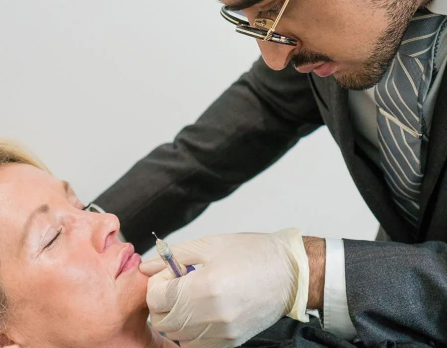Dr Adil with a chin Botox patient at Skin Science Clinic in London