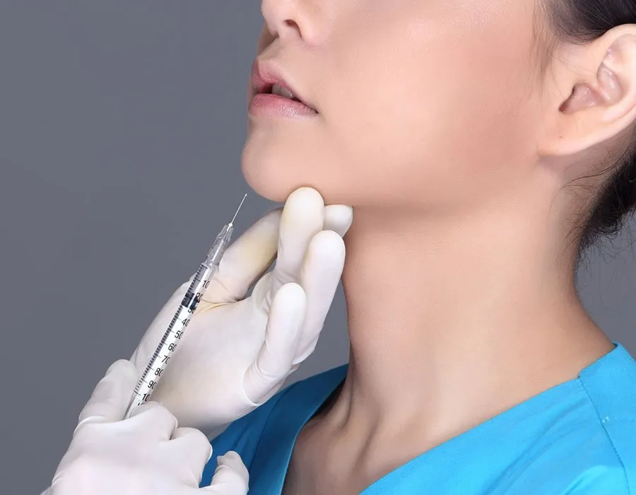 Botox injected into the chin of a young woman at Skin Science Clinic
