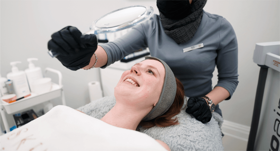 A patient looking in the mirror after cryotherapy treatment
