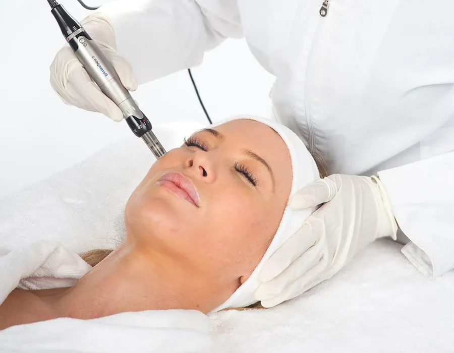 A young woman having Dermapen treatment at Skin Science Clinic in London