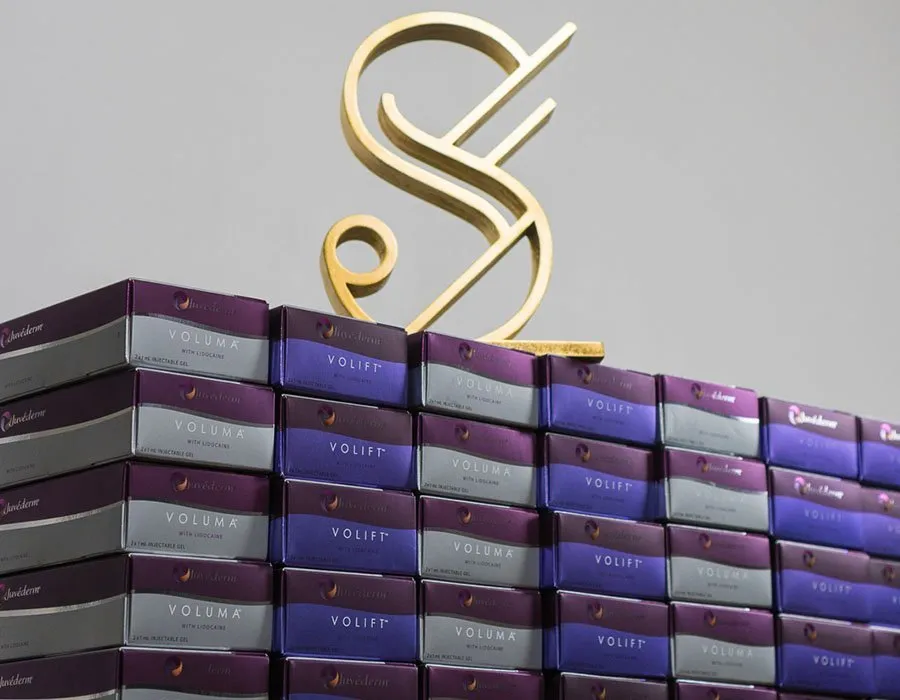 The Skin Science Clinic 3D logo sitting on dermal fillers