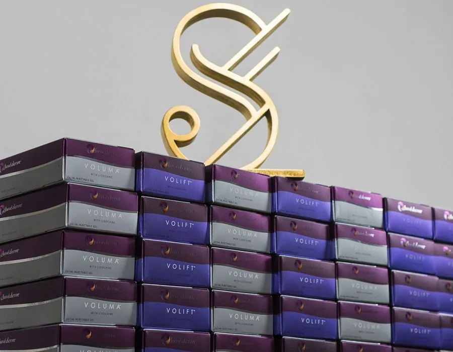 Skin Science Clinic logo sitting on dermal filler product boxes